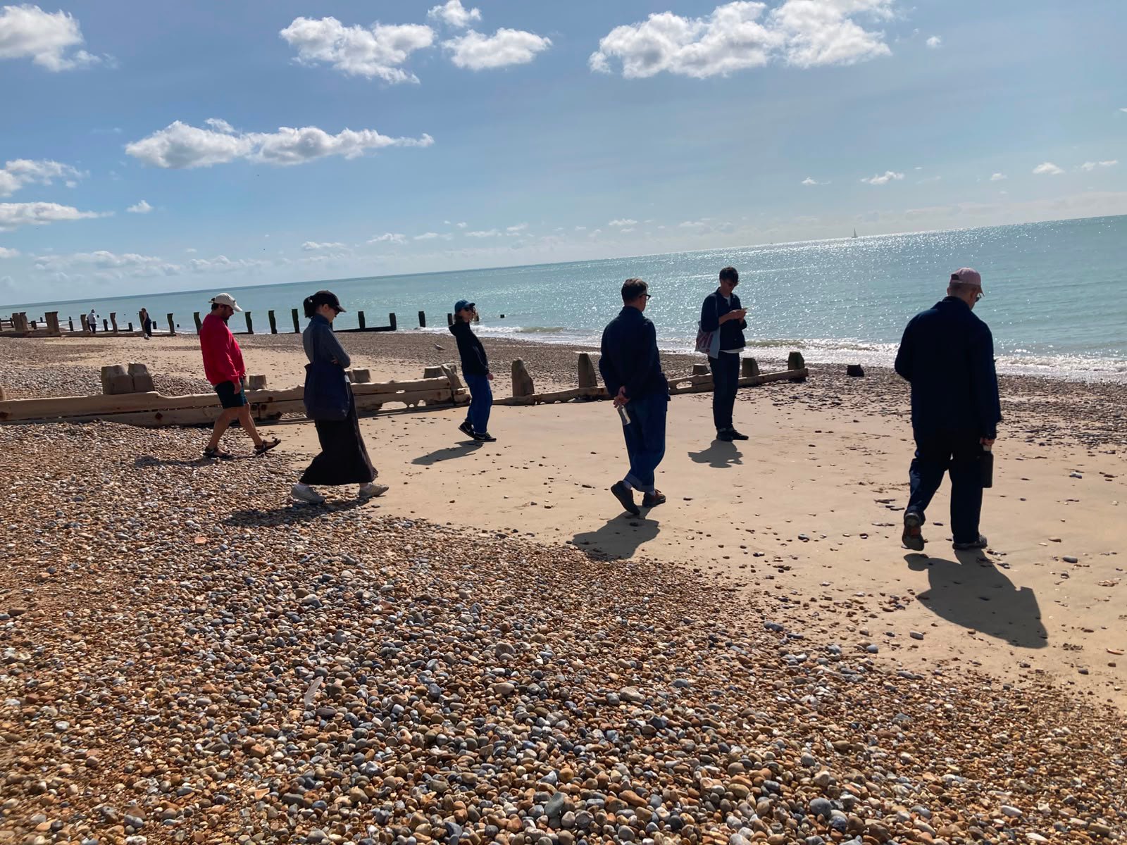 The workshop group heading towards the sea from the Bexhill promenade.